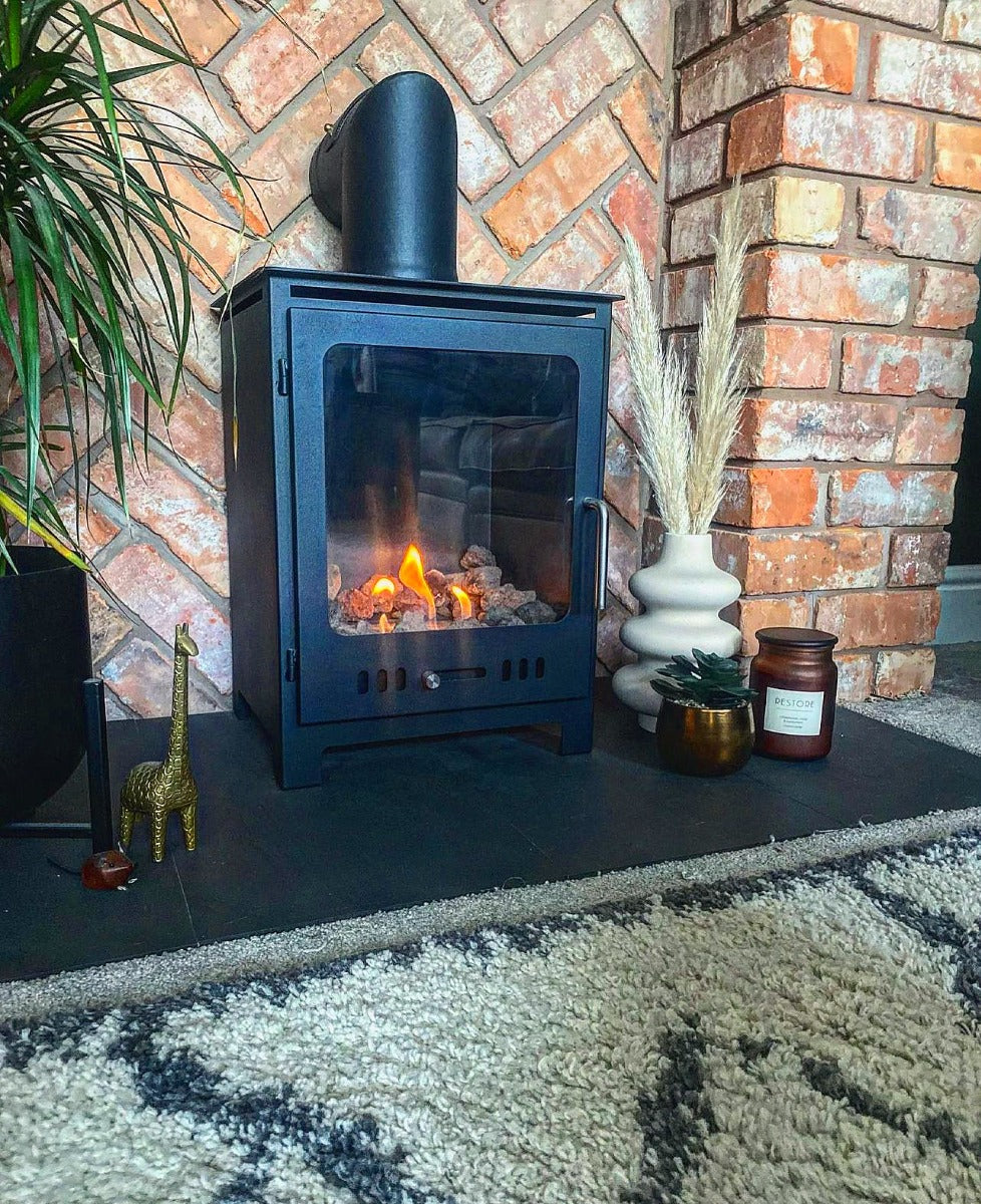 Rectangular bioethanol fireplace with a false flue mounted into a brick wall