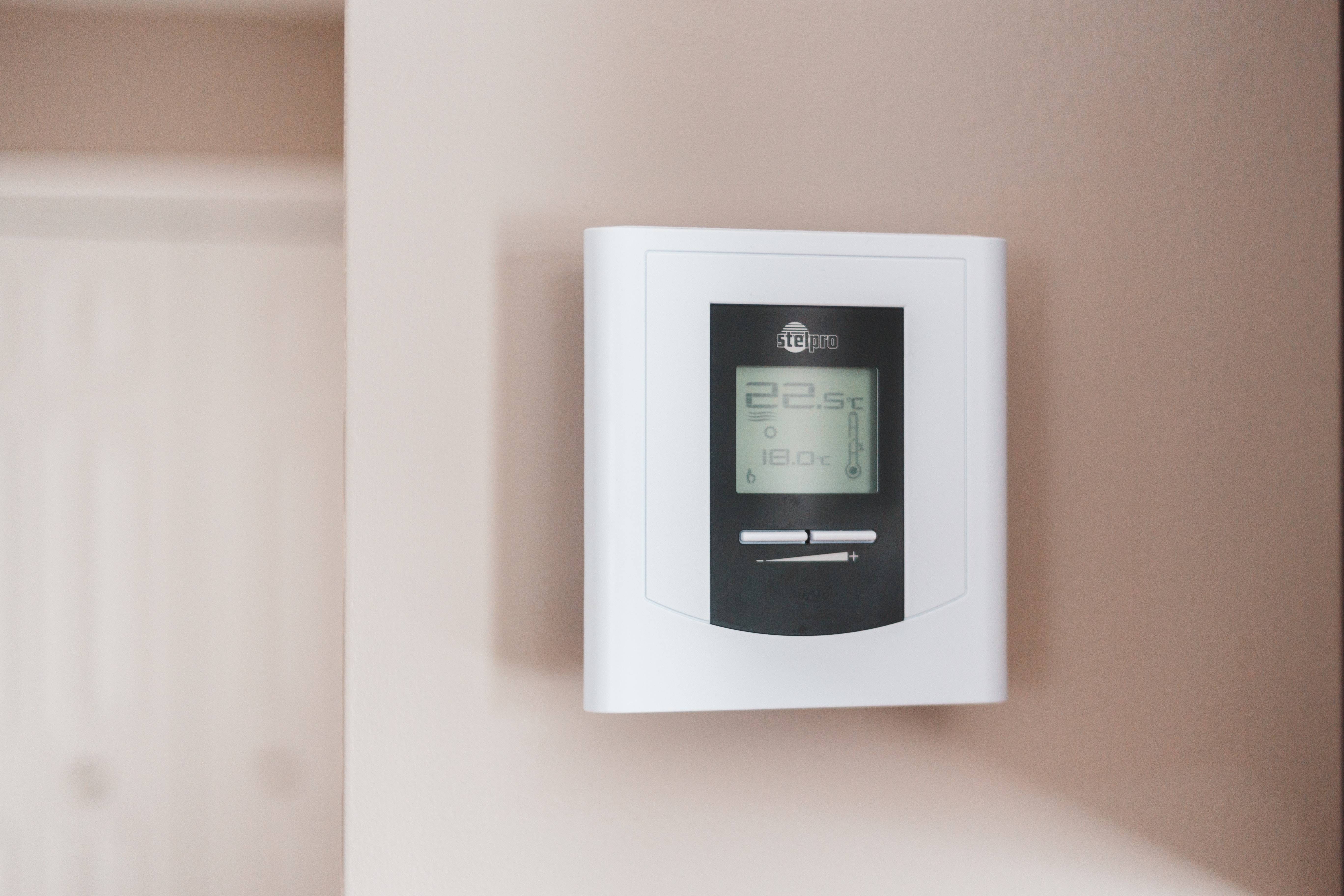 Home thermostat on the wall