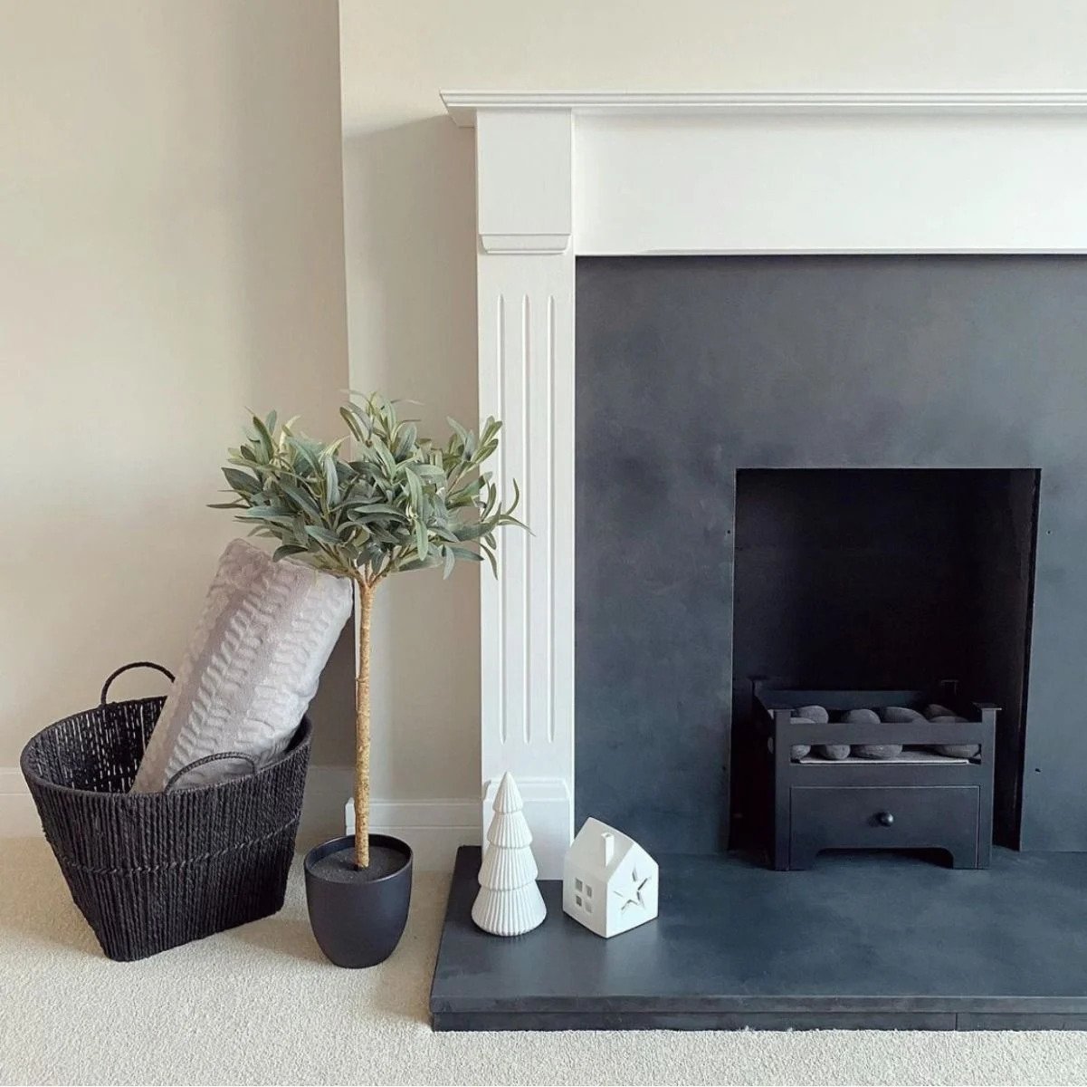 Black bioethanol fireplace insert in a converted fireplace