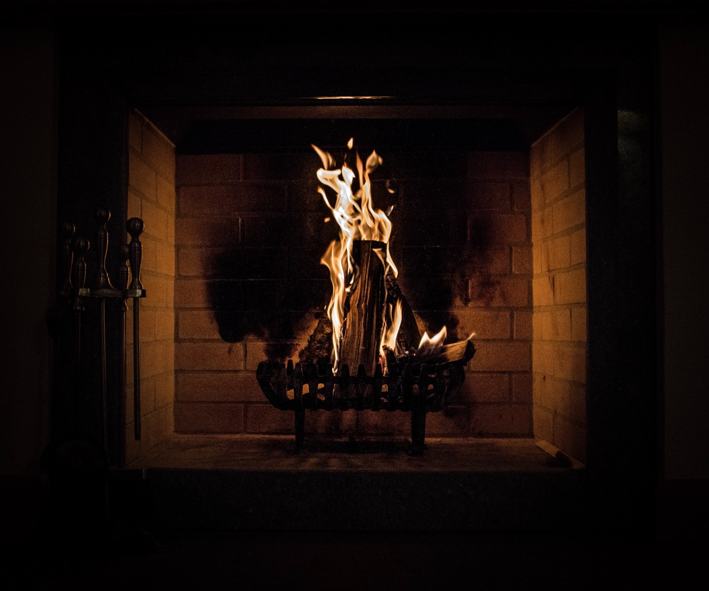 Black smoke coming out of a wood burning fireplace