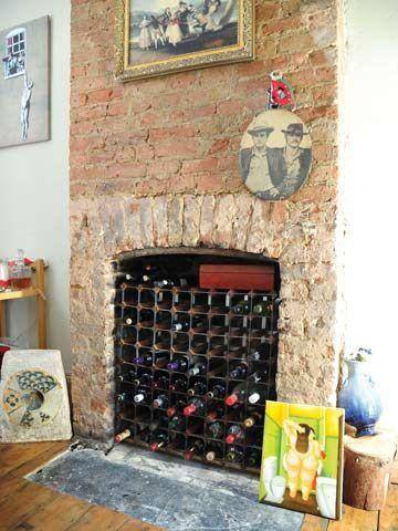 unused fireplace as a wine cellar